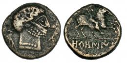 OROSIS. Unidad. A/ Cabeza masculina de estilo tosco a der. entre dos delfines. R/ Jinete lancero a der.; debajo, bajo línea, ley. ibérica OROSIS. AE 6,23 g.  CNH-3. I-1909. ACIP-1511. MBC-/BC. Muy rara.