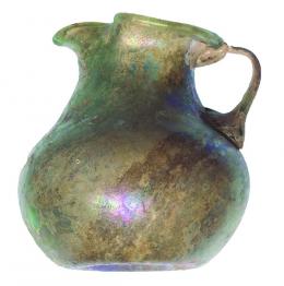 ROMA. Imperio Romano. Oinochoe (I-II d.C.). Vidrio. Altura 7,7 cm. Presenta irisaciones.
