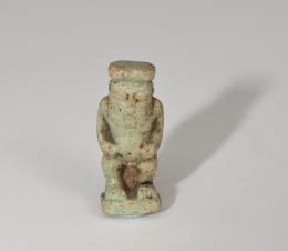 ANTIGUO EGIPTO. Período Ptolemaico. Amuleto de Bes (IV-II a.C.). Fayenza vitrificada. Altura 27 mm.