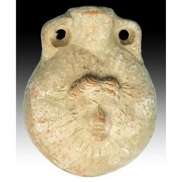 ROMA. Imperio Romano. Ampulla (I-IV d.C.) Terracota. Con representación frontal de Helios en ambas caras. Altura 8,8 cm.