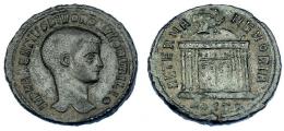 IMPERIO ROMANO. RÓMULO (hijo de Majencio). Follis. Acuñación póstuma. Ostia (309-312). A/ Cabeza a der.; IMP MAXENTIVS DIVO ROMVLO N V FILIO. R/ Templo con cúpula rematada en águila; exergo HOSTP; AETERNA MEMORIA. AE 6,23 g. 25,5 mm. RIC-33. Rara. MBC. 