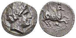 HISPANIA ANTIGUA. EMPORITON. Dracma. A/ Cabeza femenina con tocado vegetal a der., alrededor tres delfines. R/ Pegaso volando a der. con cabeza modificada, debajo delfín; EMPORITWN. AR 4,41 g. 19,8 mm. I-1118. ACIP-193. Pequeña y fina grieta. MBC+.