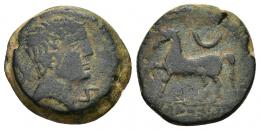 86 - HISPANIA ANTIGUA. IKALESKEN. Mitad. A/ Cabeza masculina a der., delante S, detrás delfín. R/ Caballo al paso a izq., encima creciente y estrella, debajo, ley. ibérica parcialmente visible IKALESKEN. AE 6,33 g. 19,9 mm. CNH-9 vte. ACIP-2080 vte. CC-2439, mismo ejemplar. Pátina verde oscuo. BC+. Muy rara.