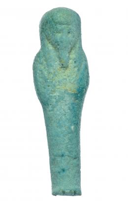 555  -  EGIPTO. Período Ptolemaico. 323-30 a.C. Fayenza vitrificada. Ushebti. Altura 6,2 cm.