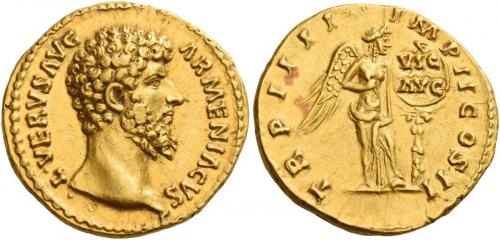 124   -  LUCIUS VERUS. Aureus. AV 7.26 g. ·L·VERVS AVG – ARMENIACVS Bare head r. Rev. TR P IIII – IMP II COS II Victory, half-draped, standing r., placing a shield inscribed VIC / AVG on a palm tree.  Minor area of weakess on obverse and unobtrusive marks, otherwise extremely fine / good extremely fine.