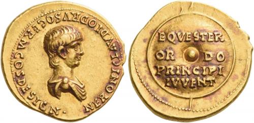 15 - NERO CAESAR. Aureus. AV 7.72 g. NERONI CLAVDIO DRVSO GERM COS DESIGN Bare headed and draped bust r. Rev. EQVESTER / OR – DO / PRINCIPI / IVVENT on shield set on vertical spear behind. Rare and in exceptional condition for the issue. A very gentle portrait struck in high relief on a very broad flan and an enchanting reddish tone. Good extremely fine.