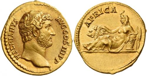61   -  HADRIAN AUGUSTUS. Aureus. AV 7.13 g. HADRIANVS – AVG COS III P P Bare head r. Rev. AFRICA Africa with elephant-skin headdress, reclining l., resting r. hand on lion and l. arm on basket; behind basket, corn ears. Very rare and in exceptional condition for this fascinating issue, undoubtedly one of the finest specimens in private hands. A wonderful portrait of fine sytle and a magnificent reverse composition. Good extremely fine.