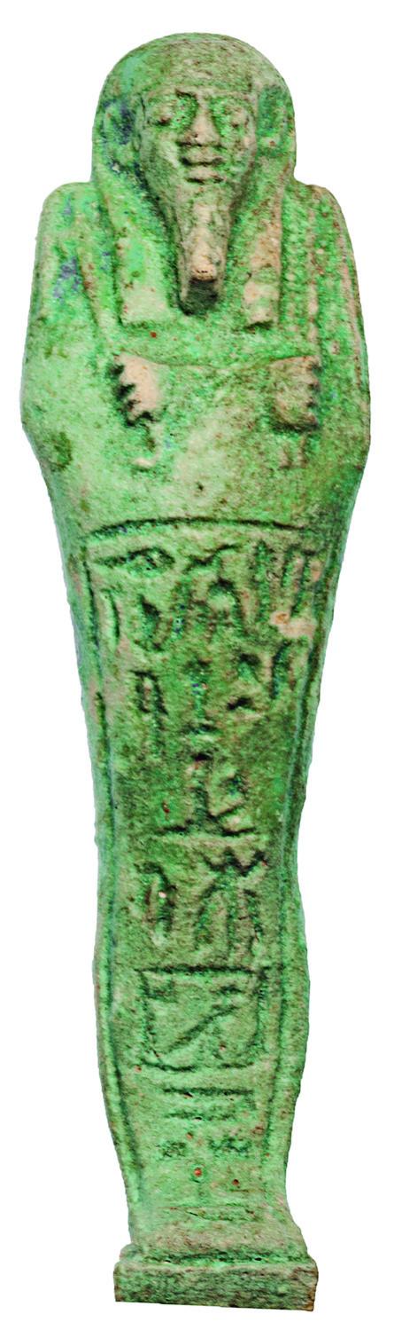 2016 - EGIPTO. Baja Época. Ushabti epigrafíado. Dinatía XXVI (664-332 a.C.). Fayenza vitrificada. Altura 18,0 cm. Incluye peana.