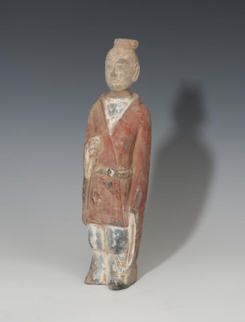 873   -  CHINA. Dinastía Wei. Figura masculina (386-535 d.C.). Terracota policromada. Vaina en la cintura. Altura 29,2 cm.