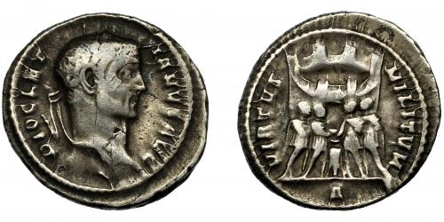 223 - DIOCLECIANO. Argénteo. Roma (295-297). R/ Los cuatro tetrarcas sacrificando sobre trípode delante de campamento con seis torretas; VIRTVS MILITVM, exergo A. AR 3,32 g. 19 mm. RIC-40a. Pequeñas marcas. MBC-/MBC.