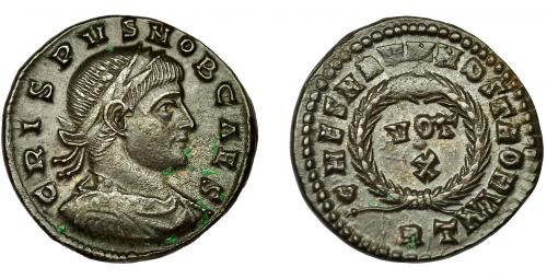 263 - CRISPO. Follis. Roma (321). R/ Corona rodeando VOT/./X; CAESARVM NOSTRORVM. AE 2,97 g. 19 mm. RIC-238. EBC-.