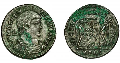 266 - MAGNENCIO. Follis. Lugdunum (350-353). A/ Marca A. R/ Corona rodeando VOT/V/MVLT/X, debajo SVI; VICTORIAE DD NN AVG ET CAE, exergo RPLG. Ae 5,18 g. 23 mm. RIC-126. Concreciones. MBC/MBC+.