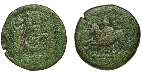 2044 - HISPANIA ANTIGUA. ITUCI. Mitad. A/ Dos espigas, en medio estrella y creciente. R/ Jinete a izq. con casco, rodela y lanza; debajo ITVCI. I-1599. ACIP-840. Pátina verde. BC. Rara.