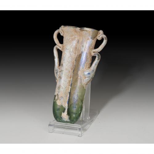 2697 - ROMA. Imperio Romano. Ungüentario doble (III-IV d.C.). Vidrio. Altura 11,0 cm. Presenta irisaciones.
