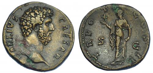 549 - IMPERIO ROMANO. AELIO. Sestercio. Roma (137). A/ Cabeza desnuda a der.; L AELIVS CAESAR. R/ Spes avanzando a izq. con flor y sujetándose el vestido; TR POT COS II, S C. AE 25,50 g. 31,1 mm. RIC-2695. Concreciones. MBC+/MBC. Rara. Procede de Sevilla. Ex col. Montera. Tejuelos de colección antigua (1918).