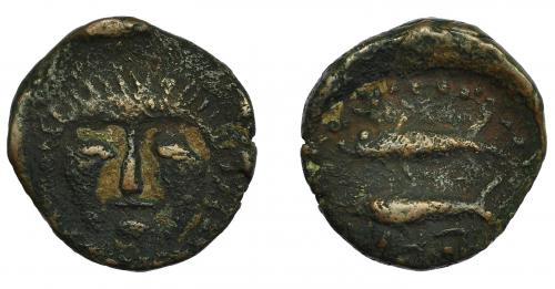 35 - HISPANIA ANTIGUA. ASIDO. Semis. A/ Cabeza frontal de Melkart con leonté. R/ Dos atunes a izq., debajo ley. libio-fenicia b'b'l. AE 4,67 g. 19,3 mm. I-156. ACIP-919. MBC-/BC+. Muy escasa.