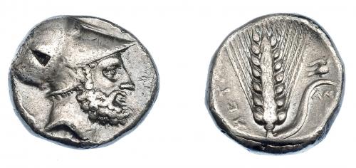326 - GRECIA ANTIGUA. LUCANIA. Metaponto. Estátera (340-330 a.C.). A/ Cabeza con casco de Leucipo a der., detrás perro, delante (LEUKIPPOS), debajo S. R/ Espiga con paloma sobre hoja a der., debajo AM, a izq. META. AR 7,81 g. 19,8 mm. COP-1210. SBG-415. Leves oxidaciones. MBC/MBC+. Ex col. Guadán 1415.