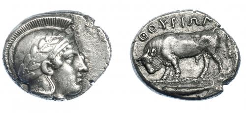 332 - GRECIA ANTIGUA. LUCANIA. Thurium. Didracma (443-400 a.C.). A/ Cabeza de Atenea a der. con casco ático decorado con rama de olivo. R/ Toro embistiendo a izq.; encima ΘOYPIΩN, en exergo pez a izq. AR 6,96 g. 20,4 mm. COP-1422 vte. SBG-436. MBC+. Muy escasa. Ex col. Guadán 1445.