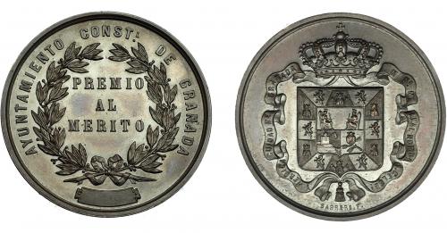 943 - ALFONSO XII. Medalla. Ayuntamiento de Granada. Premio al Mérito. Grabador: Barrére. AE 36,5 mm. SC.