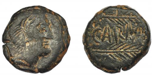 1162 - HISPANIA ANTIGUA. CARMO. As. A/ Cabeza de Hércules con leonté a der. R/ Dos espigas a der., en medio CARMO, estilo tosco. AE 18,98 g. 25,9 mm. I-466. ACIP-2395. Pátina oscura. BC+/MBC-.