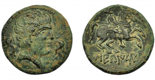 61 - HISPANIA ANTIGUA. SEKAISA. Unidad. Siglo II-I a.C. A/ Cabeza masculina a der. entre dos delfnes. R/ Jinete con lanza a der., debajo ley. ibérica SEKaISA. AE 7,51 g. 23,36mm. I-2131. ACIP-1559. Pátina oscura. MBC.