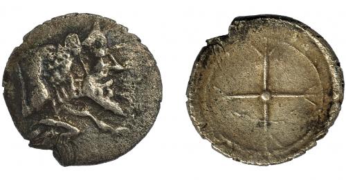 74 - GRECIA ANTIGUA. SICILIA. Gela. Óbolo. (480-475 a.C.). A/ Toro con cabeza humana a der. R/ Rueda de cuatro radios. AR 0,44 g. 9,29 mm. COP- 259.MBC-/MBC.