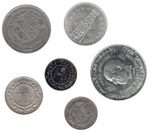 3365   -  MONEDAS EXTRANJERAS. Lote de 6 monedas: Túnez (5: 20 francos 1353H; 1 dinar 1969; 1 franco 1904; 5 francos 1355H y 2 francos 1916); y Argelia (1: 5 dinares 1972).MBC/SC. 