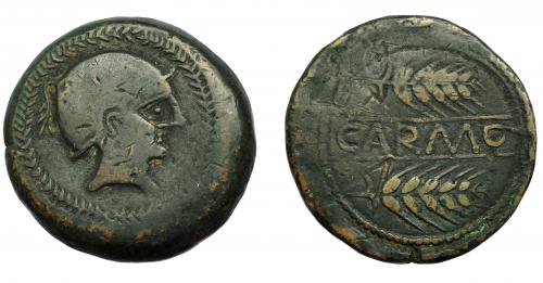 18 - HISPANIA ANTIGUA. CARMO. As. A/ Cabeza con casco a der., alrededor láurea. R/ Dos espigas, en medio entre líneas CARMO. AE 20,64 g. 32,7 mm. I-454. ACIP-2382. Pátina oscura. BC+.