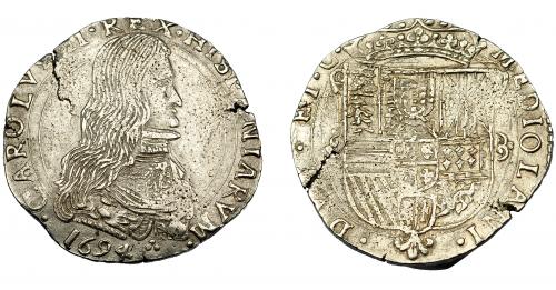 491 - CARLOS II. 1/2 filipo ancho. 1694. Milán. Olivares-285. Cospel abierto. Porosidades. MBC+.