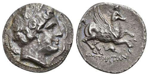 74 - HISPANIA ANTIGUA. EMPORITON. Dracma. A/ Cabeza femenina con tocado vegetal a der., alrededor tres delfines. R/ Pegaso volando a der. con cabeza modificada, debajo delfín; EMPORITWN. AR 4,41 g. 19,8 mm. I-1118. ACIP-193. Pequeña y fina grieta. MBC+.
