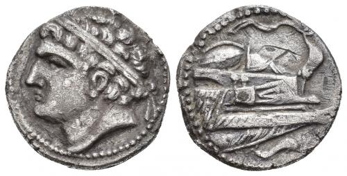 12 - HISPANIA ANTIGUA. EMISIONES HISPANO-CARTAGINESAS. Shekel. A/ Cabeza masculina diademada a izq. R/ Proa a der. con rostra, remos, aplustre y un escudo; en exergo delfín. AR 7,00 g. 21 mm. I-482. ACIP-549. CC-5463, mismo ejemplar. Pequeñas marcas y rayitas. MBC+. Muy rara.