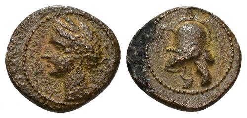 15 - HISPANIA ANTIGUA. EMISIONES HISPANO-CARTAGINESAS. 1/5. A/ Cabeza femenina con tocado vegetal a izq. R/ Casco a izq. AE 1,79 g. 13,3 mm. I-521. ACIP-582. Mancha de óxido en rev. Pátina marrón rugosa. MBC+.