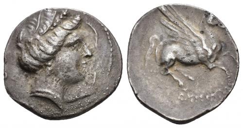 36 - HISPANIA ANTIGUA. EMPORION. Dracma. A/ Cabeza femenina con tocado vegetal a der., alrededor 3 delfines. R/ Pegaso volando a der. con cabeza modificada, debajo ley. EMPORITWN. AR 4,52 g. 20,5 mm. I-1108. ACIP-195. CC-90, mismo ejemplar. Porosidades en anv. MBC/MBC-.