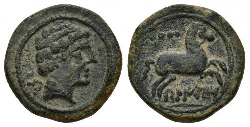 6 - HISPANIA ANTIGUA. BELIKIOM. Cuadrante. A/ Cabeza masculina con collar a der., detrás Be. R/ Caballo saltando a der., encima 4 glóbulos, debajo sobre línea BeLIKiOM. AE 3,88 g. 17,1 mm. I-248. ACIP-1436. Pátina verde. Buen centraje. MBC. Rara.