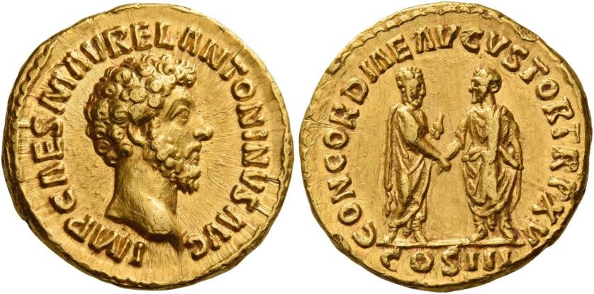 100   -  MARCUS AURELIUS CAESAR. Aureus. AV 7.34 g. IMP CAES M AVREL ANTONINVS AVG Bare head r. Rev. CONCORDIAE AVGVSTOR TR P XV M. Aurelius and L. Verus standing, facing each other with clasped hands; M. Aurelius holds roll. In exergue, COS III. Minor marks, otherwise about extremely fine.