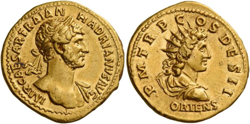 53   -  HADRIAN AUGUSTUS. Aureus. AV 7.25 g. IMP CAESAR TRAIAN – HADRIANVS AVG Laureate and draped bust r. seen from front, fold of cloak on l. shoulder and sword belt around neck and across breast. Rev. P M TR P C – OS DES II Radiate and draped bust of Sol r.; below, ORIENS. Rare. Struck on a large flan and complete, minor marks on reverse, otherwise about extremely fine.