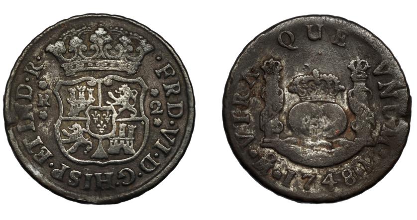 494   -  FERNANDO VI. 2 reales. 1748. México. M. VI-224. Golpe. Pátina oscura. BC+.