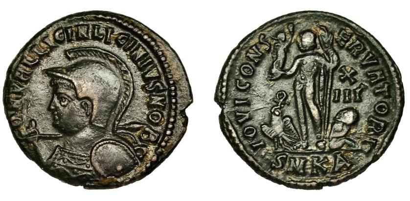 244   -  LICINIO II. Follis. Cyzicus (321-324). R/ Júpiter a izq., a sus pies águila con corona y cautivo; IOVI CONSERVATORI, en campo X/III, exergo SMKA. AE 2,93 g. 20 mm. RIC-18. MBC.