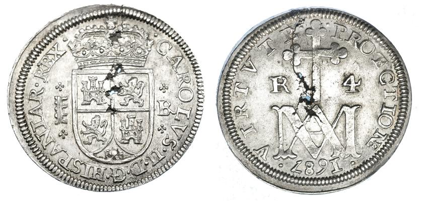 1058   -  CARLOS II. 4 reales. 1687. Segovia. BR. AC-567. Metal mal batido, que origina una grieta y perforaciones. EBC. Muy escasa.