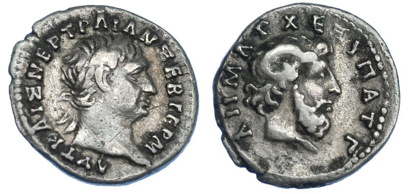 514   -  IMPERIO ROMANO. TRAJANO. Hemidracma. Cyrene (100). A/ Cabeza laureada a der.; ley. griega AYT KAIS NER TRAIAN SEB GERM. R/ Cabeza diademada de Zeus-Amón a der.; ley. griega. AR 1,80 g. 15,1 mm- RPC-3. MBC-. Rara.