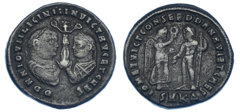 596   -  IMPERIO ROMANO. LICINIO II. Follis. Cizycus (320-321). R/ Victoria a der. ofreciendo corona de laurel a Júpiter, frente a ella con cetro; IOV ET VICT CONSER DD NN AVG ET CAES, exergo SMKA. AE 4,25 g. 21,4 mm. RIC-13. MBC-. Rara.