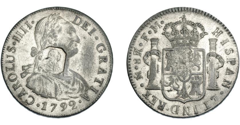 1025   -  COLECCIÓN DE RESELLOS. GRAN BRETAÑA. Dólar. Resello busto de Jorge III dentro de punzón octogonal sobre 8 reales 1792 México FM, falso de época en metal blanco. El resello, auténtico. KM-no. MBC.