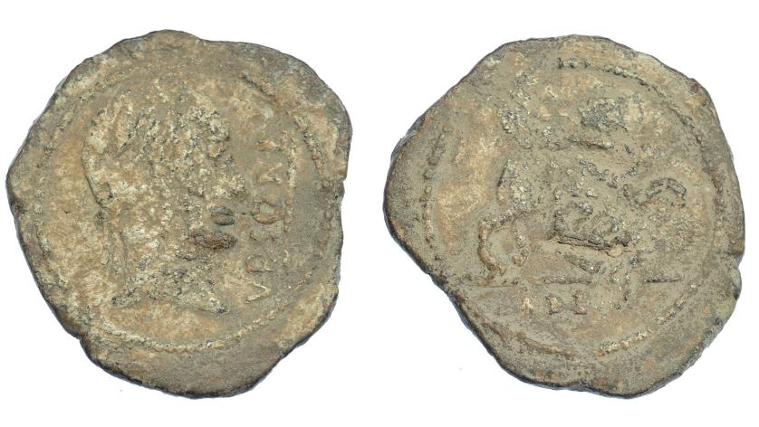 283   -  HISPANIA ANTIGUA. URSO. Plomo monetiforme. A/ Cabeza diademada con ínfulas a der., delante VRSONE con línea. R/ Esfinge a der., debajo L A(P) DEC.  Pb 24,63 g. 38 mm. CCP-p. 16, 2. BC.