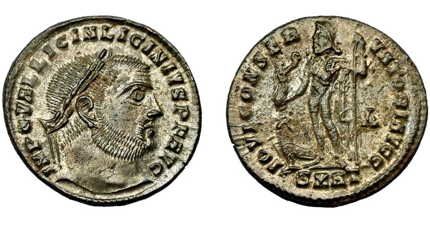 389   -  IMPERIO ROMANO. LICINIO I. Follis. Heraclea (313). R/ Júpiter con Victoria y cetro a izq., a los pies águila; -A/SMHT. AE 3,55 g. 21,9 mm. RIC-73. B.O. EBC.