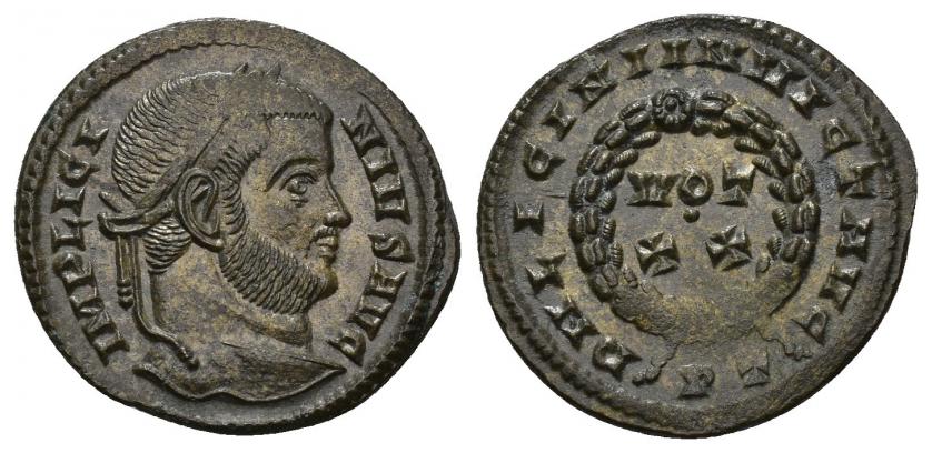 3297   -  IMPERIO ROMANO. LICINIO I. Follis. Ticinum (320-321). A/ Cabeza laureada a der.; IMP LICINIVS AVG. R/ Láurea rodeando VOT/XX; DN LICINI INVICT AVG, exergo PT. AE 2,58 g. 19,1 mm. RIC-146. Leves vanos. EBC.