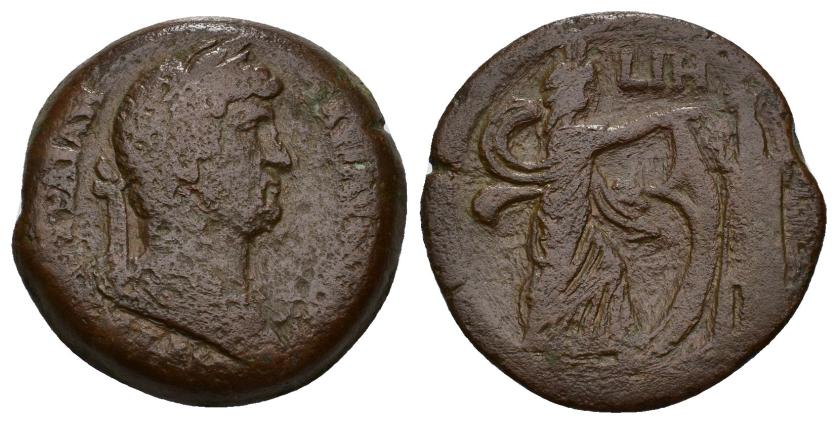 317   -  IMPERIO ROMANO. ADRIANO. AE 33 mm. Alejandría. A/ Busto laureado, drapeado y acorazado a der.; (AUT KAIC) TRAIAN ADRIANOC CEB (poco visible). R/ Isis Faria avanzando a der. con sistro y vela, delante faro, en campo LIH (año 18). AE 23,13 g. 32,7 mm. RPC-5895. Pátina marrón rugosa. BC/MBC-. 