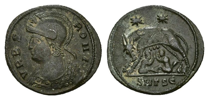 438   -  IMPERIO ROMANO. CONSTANTINO I. Follis reducido. Thessalonica (330-333). A/ Busto de Roma a izq.; VRBS ROMA. R/ Loba con los gememlos a izq., encima dos estrellas, exergo SMTSE. AE 2,44 g. 19 mm. RIC-187. Pátina verde. MBC+.