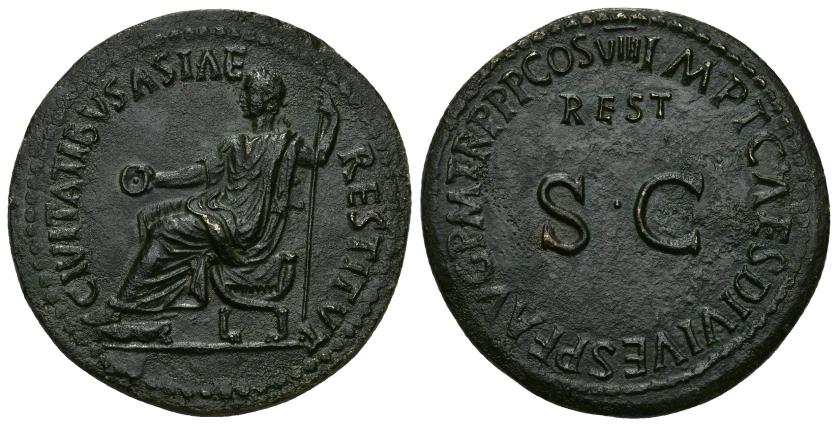 153   -  IMPERIO ROMANO. TITO. Restitución de Tiberio. Sestercio. Roma (80-81 d.C.). A/ Tiberio togado con pátera y cetro sentado en silla curul a izq.; CIVITATIBVS ASIAE RESTITVT. R/ S C, encima REST; IMP T CAES DIVI VESP AVG P M TR P P P COS VIII. AE 21,06 g. 33,9 mm. RIC-410. Pátina oscura. EBC. Rara. Sestercio que conmemora la restauración de las ciudades de Asia, que el gobierno imperial ayudó a reconstruir tras el gran terremoto de Lidia del año 17, calificado por Plinio el Viejo como el mayor terremoto que se recuerda y que afectó gravemente a una docena de ciudades de la provincia de Asia Menor, siendo la más afectada Sardes. Por ello Tiberio acordó eximir de impuestos a las ciudades afectadas durante cinco años y envió un donativo de 10 millones de sestercios. En agradecimiento, las ciudades acordaron levantar una gran estatua del emperador en el Foro de Julio César en Roma. Estas piezas, acuñadas en Roma en el año 22-23, conmemoran las ayudas. Años después, en el 80, Tito, hizo una nueva emisión de estas piezas manteniendo el anverso, y poniendo su propio nombre en el reverso, indicando que era una restitución.