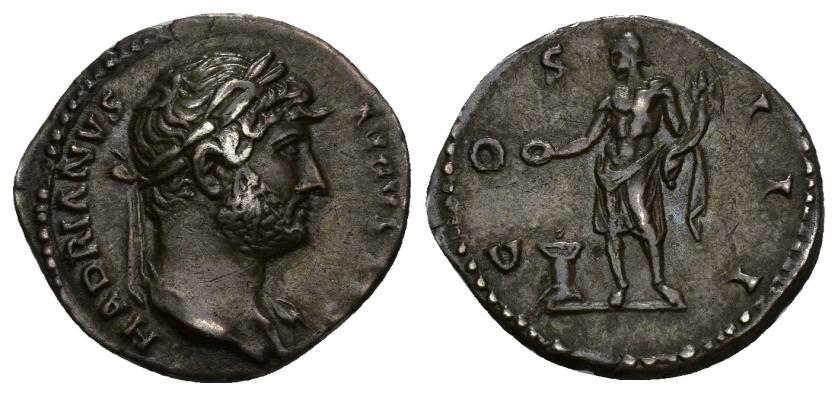 169   -  IMPERIO ROMANO. ADRIANO. Denario. Roma (124-125). R/ Genio a izq. con cornucopia y pátera ofrendando en altar; COS III. AR 3,17 g. 19 mm. RIC-724. Pátina gris. MBC+.