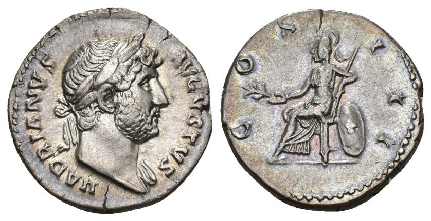 171   -  IMPERIO ROMANO. ADRIANO. Denario. Ceca oriental (124-127). R/ Roma sentada a izq. sobre escudo, con rama y lanza; COS III. AR 3,29 g. 18,2 mm. RIC-2995A. Cospel abierto. EBC-. 